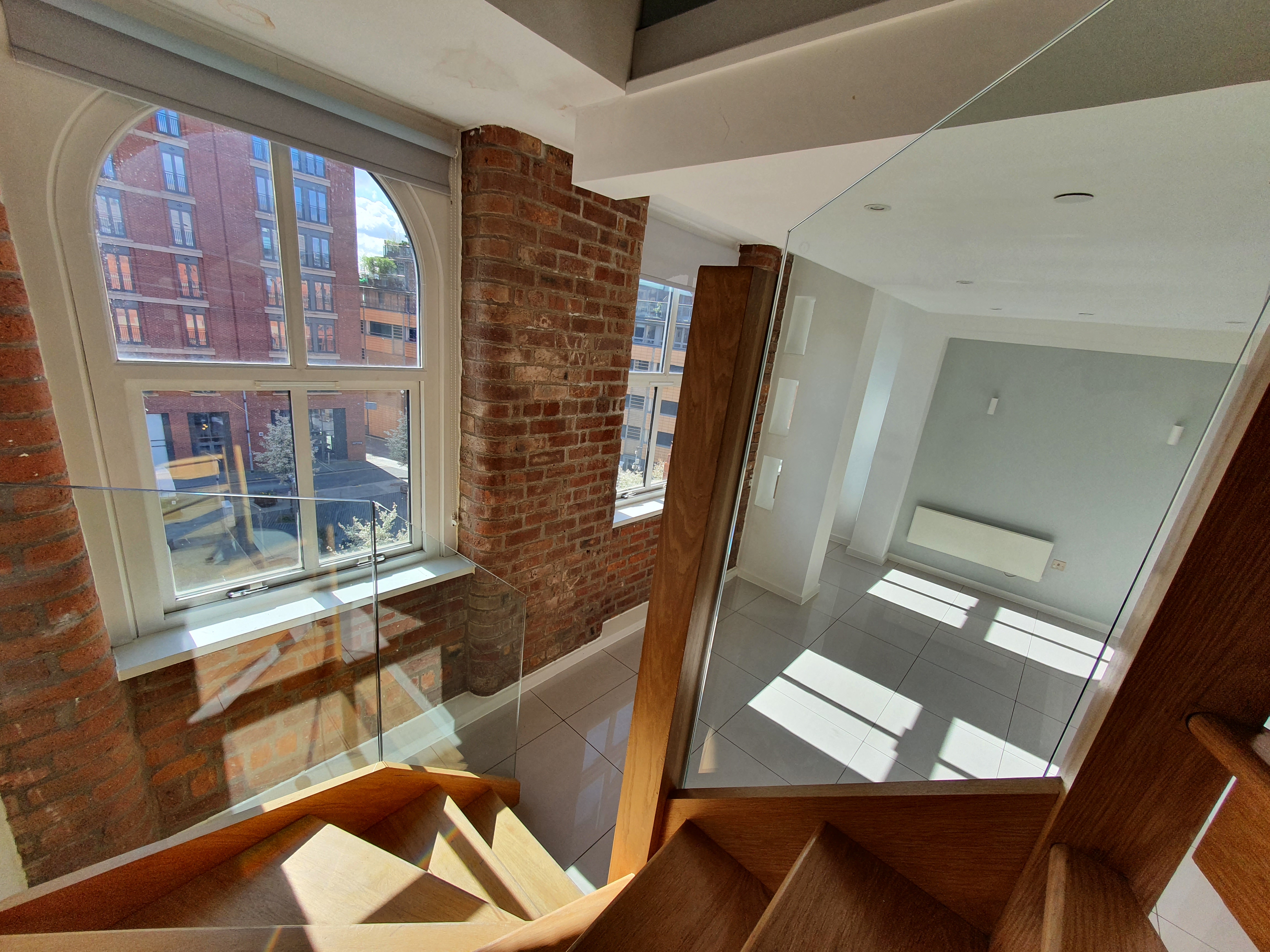 Ice Plant duplex apartment with stairs and exposed brickwork