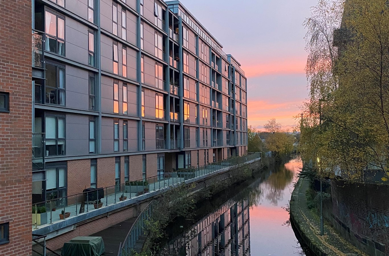 Flint Glass Wharf apartments next to Rochdale Canal at sunset